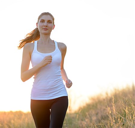 simsearch:6109-06004563,k - Young Beautiful Woman Running on the Mountain Trail in the Morning. Active Lifestyle Stockbilder - Microstock & Abonnement, Bildnummer: 400-07916719