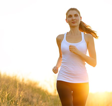 simsearch:6109-06004563,k - Young Beautiful Woman Running on the Trail in the Morning. Active Lifestyle Stockbilder - Microstock & Abonnement, Bildnummer: 400-07916720