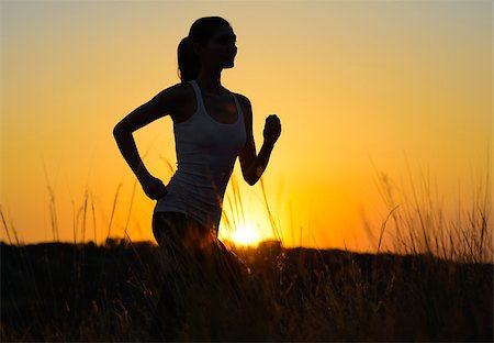 simsearch:6109-06004563,k - Young Beautiful Woman Running on the Mountain Trail in the Morning. Active Lifestyle Stockbilder - Microstock & Abonnement, Bildnummer: 400-07916721