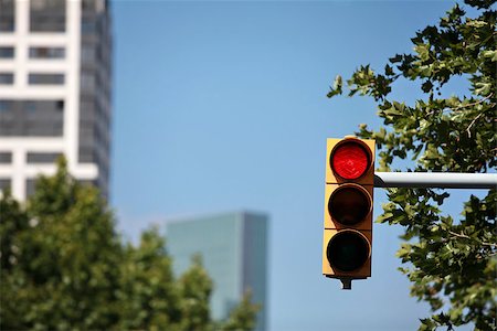 road stop alert - Red traffic light on the background of the cityscape Stock Photo - Budget Royalty-Free & Subscription, Code: 400-07916916