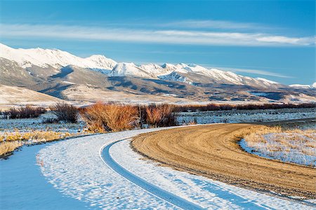 dirt backcountry road with  snowy Medicine Bow Mountains in background, North Park near Walden, Colorado, late fall scenery Stock Photo - Budget Royalty-Free & Subscription, Code: 400-07917011