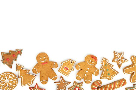 simsearch:400-07175496,k - Homemade various christmas gingerbread cookies on white background Fotografie stock - Microstock e Abbonamento, Codice: 400-07917329