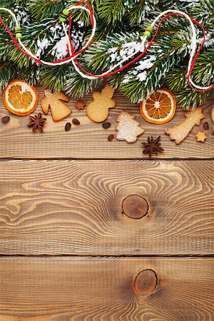 simsearch:400-07614271,k - Christmas wooden background with snow fir tree, spices, gingerbread cookies. View from above with copy space Foto de stock - Royalty-Free Super Valor e Assinatura, Número: 400-07917356