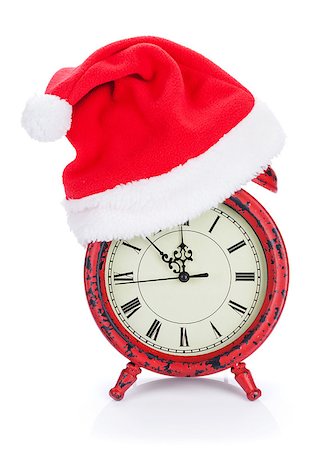 Christmas clock with santa hat. Isolated on white background Stock Photo - Budget Royalty-Free & Subscription, Code: 400-07917429