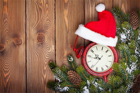 Christmas wooden background with clock, snow fir tree and copy space Stock Photo - Budget Royalty-Free & Subscription, Code: 400-07917437