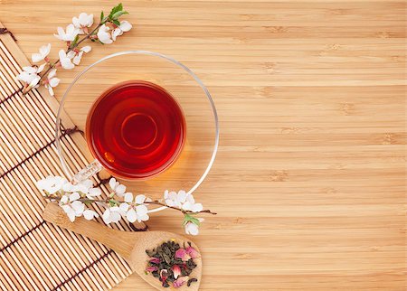 Japanese green tea and sakura branch over mat and bamboo table with copy space Stock Photo - Budget Royalty-Free & Subscription, Code: 400-07917455