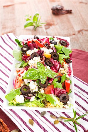 simsearch:400-07485939,k - Tasty summer salad with fresh ingredients and herbs on kitchen towel on dark wooden table. Stock Photo - Budget Royalty-Free & Subscription, Code: 400-07917604