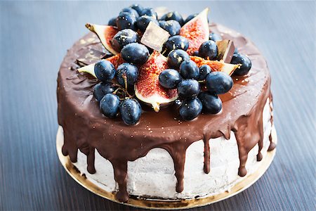 Homemade chocolate frosted cake decorated with fresh fruit Stock Photo - Budget Royalty-Free & Subscription, Code: 400-07917641