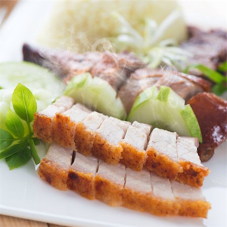 pig roast - Chinese roasted pork belly served with soy and seafood sauce. Singapore cuisine. Fresh cooked with hot steam and smoke. Stock Photo - Budget Royalty-Free & Subscription, Code: 400-07917679