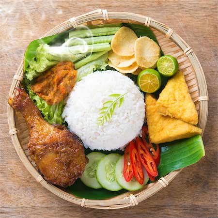 raw chicken dishes - Famous traditional Indonesian food. Delicious nasi ayam penyet with sambal belacan. Fresh hot with steam smoke. Stock Photo - Budget Royalty-Free & Subscription, Code: 400-07917687