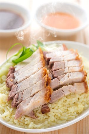 pig roast - Chinese crispy roasted belly pork rice. Fresh cooked with hot steam and smoke. Stock Photo - Budget Royalty-Free & Subscription, Code: 400-07917681