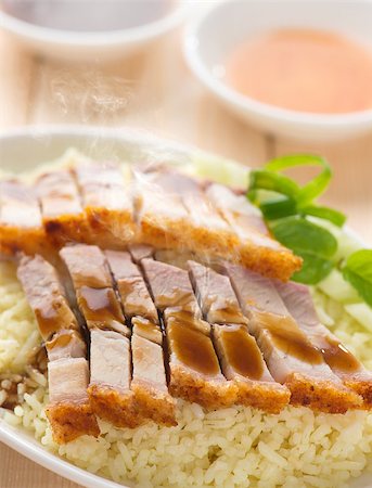 pig roast - Chinese roasted pork belly rice served with soy and seafood sauce. Malaysian cuisine. Fresh cooked with hot steam and smoke. Stock Photo - Budget Royalty-Free & Subscription, Code: 400-07917682