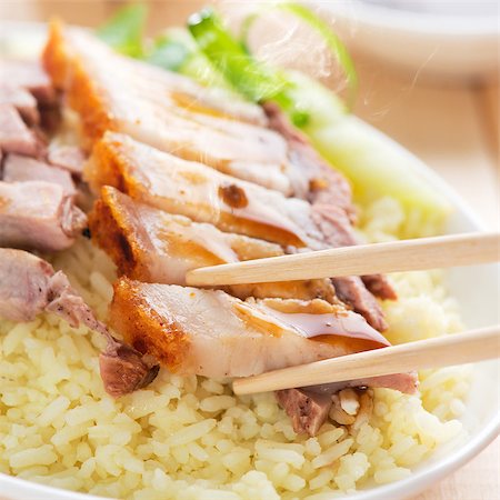 pig roast - Chinese roasted pork served with soy and seafood sauce. Hong Kong cuisine. Close up on meat and chopsticks. Fresh cooked with hot steam and smoke. Stock Photo - Budget Royalty-Free & Subscription, Code: 400-07917683