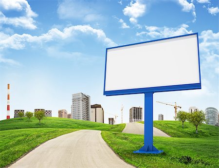 empty modern road - Tall buildings, green hills and road with large billboard against sky with clouds. Architectural concept Stock Photo - Budget Royalty-Free & Subscription, Code: 400-07918993