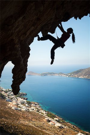 simsearch:400-08072896,k - Silhouette of a young female rock climber on a cliff. Kalymnos Island, Greece Foto de stock - Royalty-Free Super Valor e Assinatura, Número: 400-07919170