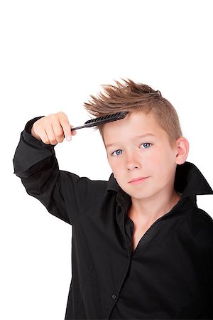 Charming boy with hairbrush and modern cool haircut isolated on white background. Stock Photo - Budget Royalty-Free & Subscription, Code: 400-07919265