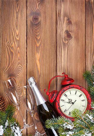 Christmas background with clock, snow fir tree and champagne over wood Stock Photo - Budget Royalty-Free & Subscription, Code: 400-07919365