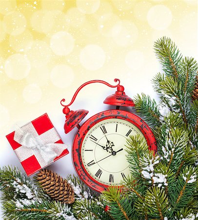 Christmas background with clock, gift box, snow fir tree and copy space with bokeh Stock Photo - Budget Royalty-Free & Subscription, Code: 400-07919366
