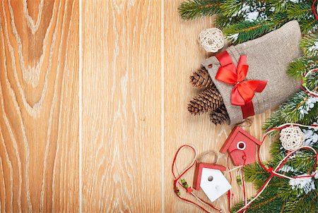 simsearch:400-07246701,k - Christmas wooden background with snow fir tree, decor and copy space Stock Photo - Budget Royalty-Free & Subscription, Code: 400-07919360