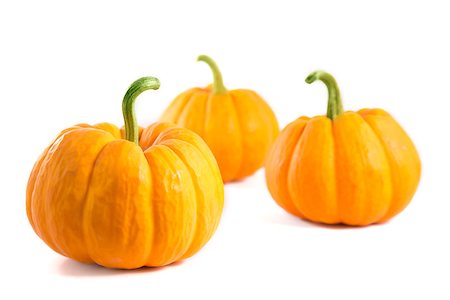 simsearch:400-08400066,k - Three decorative orange pumpkins, isolated on white background Photographie de stock - Aubaine LD & Abonnement, Code: 400-07919491