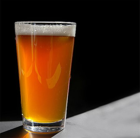 pint head - Pint glass of craft beer, backlit on black Stock Photo - Budget Royalty-Free & Subscription, Code: 400-07919515