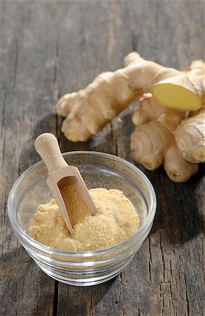 ginger root and ground ginger spice on wooden background Stock Photo - Budget Royalty-Free & Subscription, Code: 400-07919722