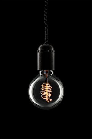 Glowing vintage style lightbulb turned on Fotografie stock - Microstock e Abbonamento, Codice: 400-07919850