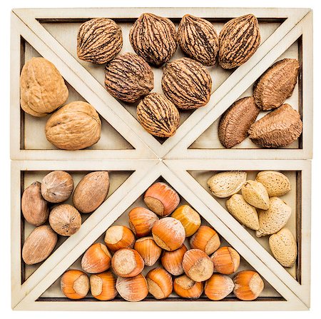 simsearch:400-07914672,k - variety of nuts (pecan, almond, black and English walnuts, hazelnuts, and Brazilian nuts)) in a geometrical wood tray inspired by CHinese tangram puzzle Photographie de stock - Aubaine LD & Abonnement, Code: 400-07924025
