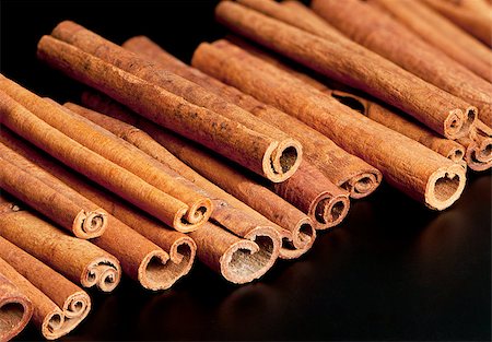 Cinnamon sticks on the black background Stock Photo - Budget Royalty-Free & Subscription, Code: 400-07924523