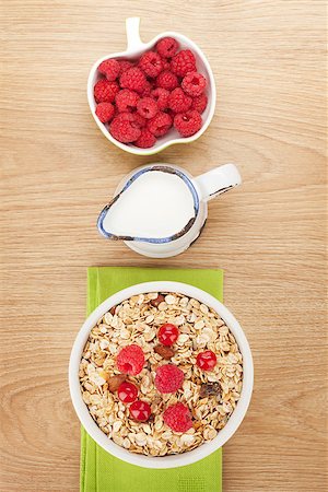 porridge and berries - Healty breakfast with muesli, berries and milk on wooden table Stock Photo - Budget Royalty-Free & Subscription, Code: 400-07925209