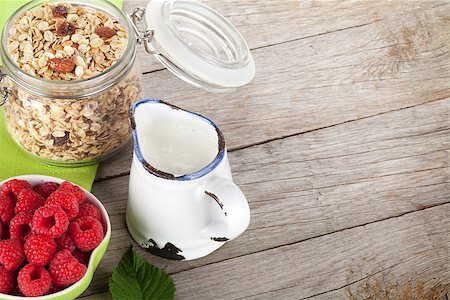porridge and berries - Healty breakfast with muesli, berries and milk. View from above on wooden table with copy space Stock Photo - Budget Royalty-Free & Subscription, Code: 400-07925213