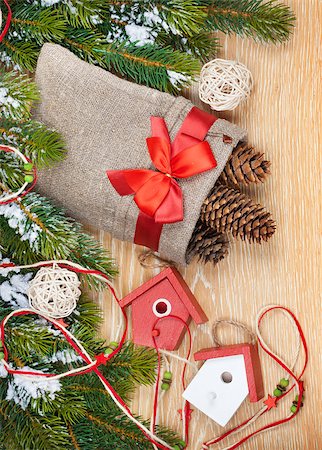 simsearch:400-07246701,k - Christmas wooden background with snow fir tree, decor Stock Photo - Budget Royalty-Free & Subscription, Code: 400-07925277