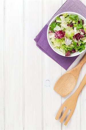 simsearch:400-06485512,k - Fresh healthy salad and utensils over white wooden table. View from above with copy space Stock Photo - Budget Royalty-Free & Subscription, Code: 400-07925305
