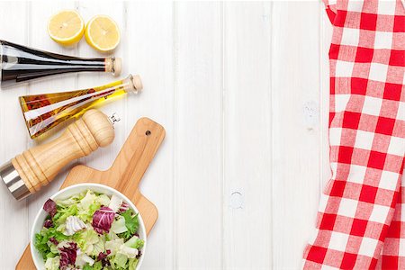 simsearch:400-06485512,k - Fresh healthy salad and condiments over white wooden table. View from above with copy space Stock Photo - Budget Royalty-Free & Subscription, Code: 400-07925307