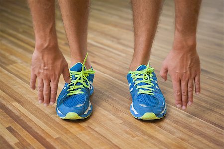 simsearch:400-07688341,k - Close up low section of a man in sports shoes in fitness studio Stock Photo - Budget Royalty-Free & Subscription, Code: 400-07925661