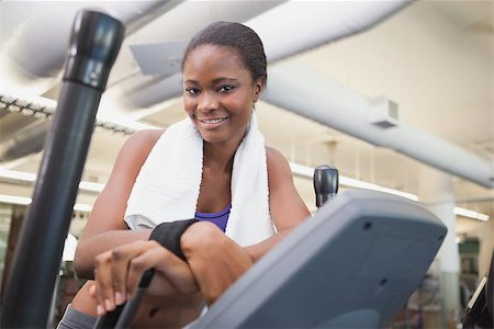 simsearch:400-07777565,k - Fit woman working out on the cross trainer at the gym Stockbilder - Microstock & Abonnement, Bildnummer: 400-07926011