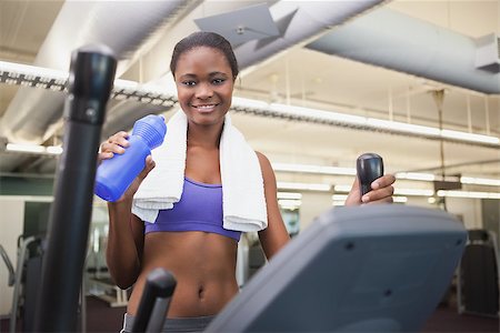 simsearch:400-07777565,k - Fit woman working out on the cross trainer at the gym Stockbilder - Microstock & Abonnement, Bildnummer: 400-07926012