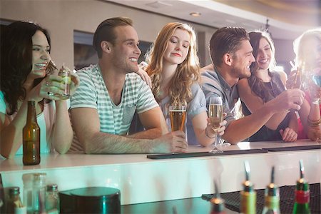 drunk teen - Happy friends having a drink together in a bar Stock Photo - Budget Royalty-Free & Subscription, Code: 400-07926590