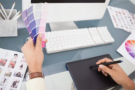 simsearch:400-07466593,k - Designer working at desk using digitizer and colour sample in his office Stock Photo - Budget Royalty-Free & Subscription, Code: 400-07926800