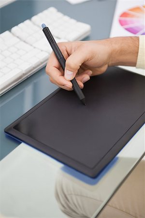 simsearch:400-07466593,k - Designer working at desk using digitizer in his office Stock Photo - Budget Royalty-Free & Subscription, Code: 400-07926801