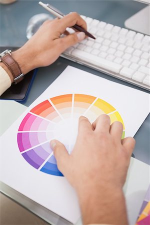 simsearch:400-07466593,k - Designer using a colour wheel and typing on keyboard in his office Stock Photo - Budget Royalty-Free & Subscription, Code: 400-07926819