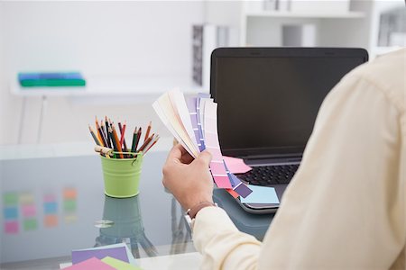 simsearch:400-07926810,k - Designer working at his desk with colour sample in his office Fotografie stock - Microstock e Abbonamento, Codice: 400-07926812