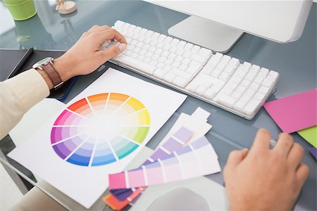 simsearch:400-07466593,k - Designer using computer and colour wheel in his office Stock Photo - Budget Royalty-Free & Subscription, Code: 400-07926820