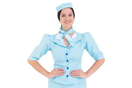 Pretty air hostess smiling at camera on white background Stock Photo - Budget Royalty-Free & Subscription, Code: 400-07926927