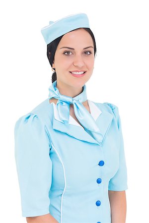 simsearch:400-07752842,k - Pretty air hostess smiling at camera on white background Stock Photo - Budget Royalty-Free & Subscription, Code: 400-07926936