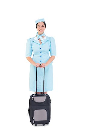 simsearch:400-07752842,k - Pretty air hostess holding suitcase on white background Stock Photo - Budget Royalty-Free & Subscription, Code: 400-07926930