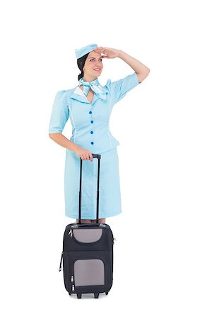 Pretty air hostess holding suitcase on white background Stock Photo - Budget Royalty-Free & Subscription, Code: 400-07926931