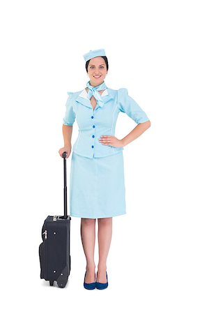 simsearch:400-07752842,k - Pretty air hostess holding suitcase on white background Stock Photo - Budget Royalty-Free & Subscription, Code: 400-07926933