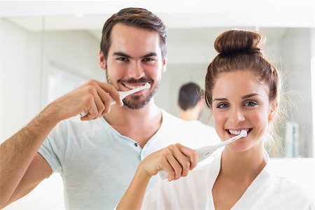 Young couple brushing their teeth at home in the bathroom Stock Photo - Budget Royalty-Free & Subscription, Code: 400-07927238