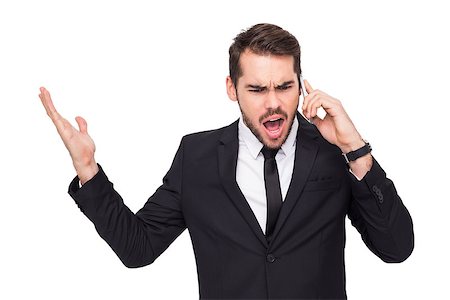 simsearch:400-07139155,k - Angry businessman gesturing on the phone on white background Stock Photo - Budget Royalty-Free & Subscription, Code: 400-07927298